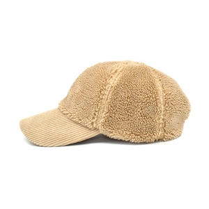 Detail of faux shearling baseball cap with textured corduroy brim in camel beige