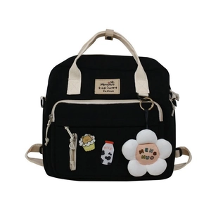 Versatile black canvas crossbody bag with cute charms and multiple pockets for students