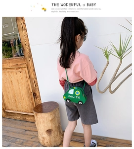 Detailed back view of a child wearing a green police car shaped mini PU leather shoulder bag