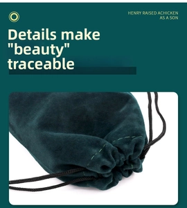 Detailed view of dark green velvet jewelry pouch with black drawstring closure and stitching