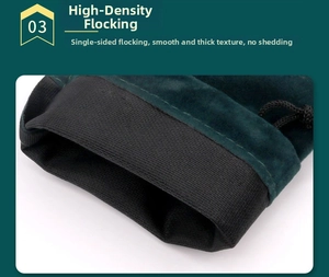 Detail of dark green flocked drawstring jewelry pouch with smooth texture and black trim