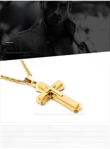 Detailed view of 54x30mm gold stainless steel cross pendant on a twist chain necklace