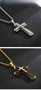 Macro detail of triple-layered cross pendant with brushed metal finish and rope chain
