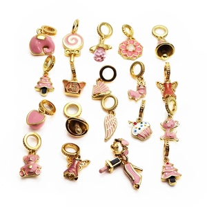 Pink enamel and gold plated brass pendants collection with animal and flower shapes