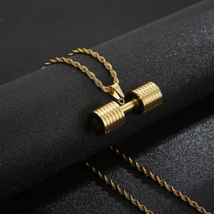 Minimalist gold dumbbell pendant with twisted rope chain on black matte surface