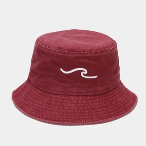 Detail of burgundy washed cotton bucket hat with white wave embroidery and stitching
