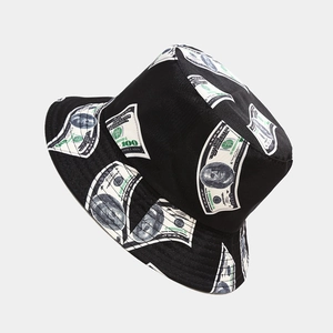 Close-up of black bucket hat featuring green dollar bill patterns and detailed stitching