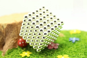 Detailed view of 216 silver magnetic spheres formed into a 5mm buckyball cube structure