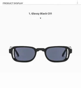 Detail view of glossy black square sunglasses with unique hollowed frame and dark gray lenses
