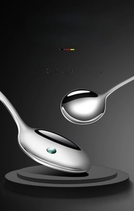Macro view of mirror polished stainless steel spoons and material grade color test chart