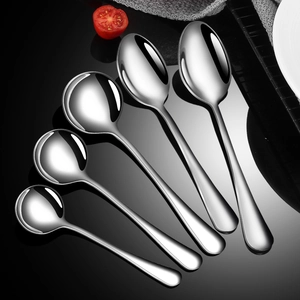 Polished stainless steel spoons in five sizes arranged fan-like on a dark background