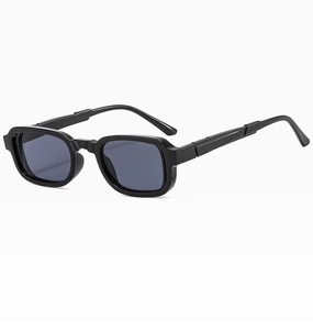 Detail of vintage black square sunglasses featuring a glossy frame and dark grey lenses