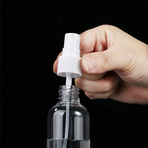 Set of clear 100ml PET spray bottles with white fine mist atomizers for travel use