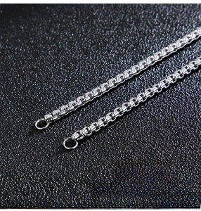 Macro shot of 3.5mm stainless steel silver box chain jewelry with precise casting details