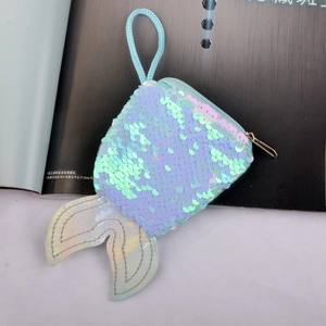 Macro view of colorful sequin mermaid tail coin purse with metallic zipper and cord