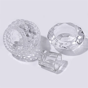 Three transparent glass nail art containers including octagonal bowl and round dotted jar