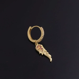 Detailed close-up of gold hoop earrings with colorful zircon-studded wing charm on black