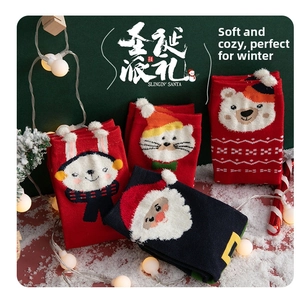 Detail of red and navy Christmas socks featuring 3D cartoon Santa, bear, and cat designs