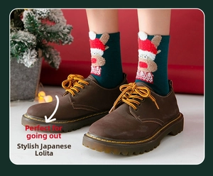 Detail of dark brown matte leather boots with festive reindeer socks and yellow stitching
