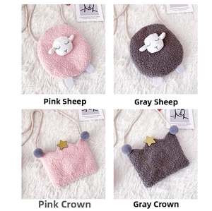 Detail view of plush cartoon purses in sheep and crown designs for kids and girls