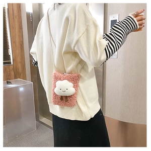 Pink plush lamb wool cloud shoulder bag shown on model for size and style perspective