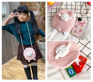 Pink plush lamb crossbody bag for kids showing size reference and interior capacity