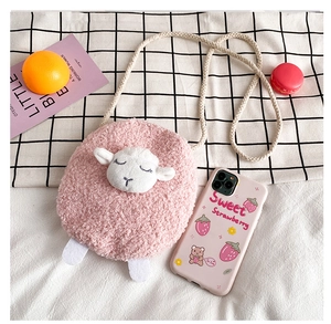 Detailed view of pink plush sheep crossbody bag with cotton rope strap and embroidery