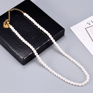 Classic pearl necklace with 18K gold plated clasp and extension chain on black gift box