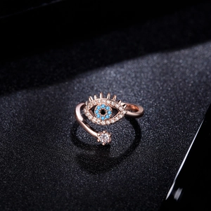 Rose gold adjustable Evil Eye ring with blue stone and sparkling zircon accents
