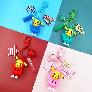 Detailed view of four colorful Pikachu keychains with hoodies and decorative charms