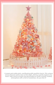 Pink Christmas tree with glowing star topper and ribbons on soft white carpet