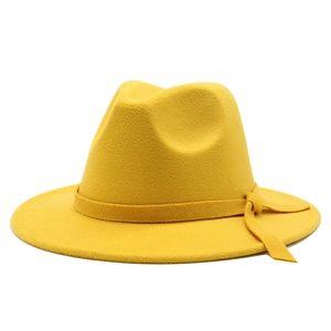 Classic bright yellow wool fedora hat with flat wide brim and matching decorative band