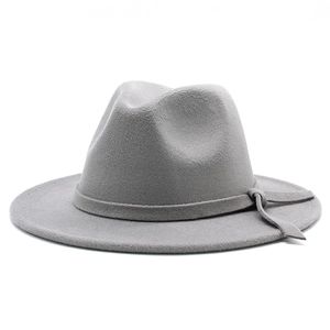 Close-up of the smooth texture and buckle detail on a grey wool wide-brim fedora hat