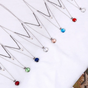 Multi-layered titanium steel necklace set with colorful glass stones and pearls
