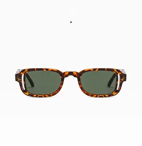 Detail of leopard print square sunglasses frame with dark green lenses and silver accents