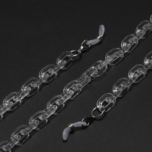 Close-up of clear acrylic leopard chain with metal lobster clasps and silicone loops