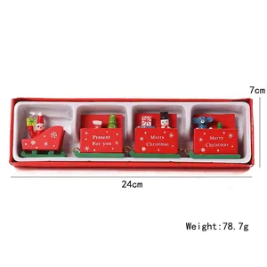 Christmas wooden train set with Santa and snowman figures on red and green painted carriages