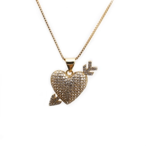 Golden necklace featuring a heart-arrow pendant with shimmering pavé set clear crystals