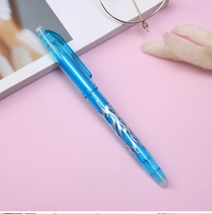 Detail of blue erasable gel pen with silver pattern on a minimalist pink background