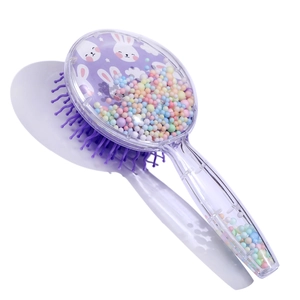 Close-up of cute bunny pattern and colorful foam beads inside transparent hairbrush