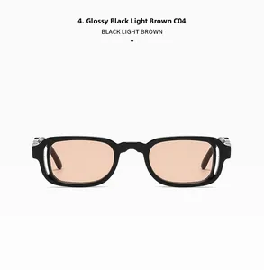 Detailed close-up of glossy black rectangular sunglasses frame with light brown lenses