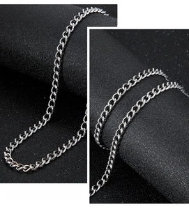 Detailed close-up of a silver stainless steel Cuban link chain necklace for men