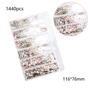 Macro detail of AB iridescent flatback rhinestones for nail art in a 116x76mm bag