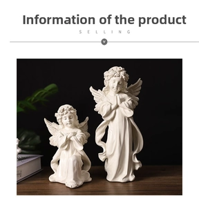 Close-up of matte white praying angel statues with detailed feather wings and flower crowns