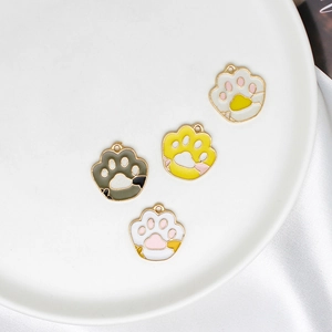 DIY cat paw charms in white, yellow and grey enamel for handmade jewelry making