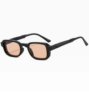 Detail of vintage square sunglasses featuring black thick frames and amber lenses