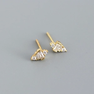 Close-up of gold S925 silver stud earrings with rectangle and round cubic zirconia