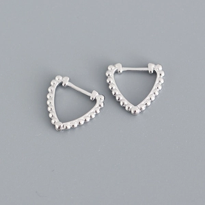 Detailed close-up of S925 sterling silver heart-shaped earrings with beaded texture