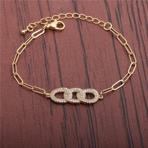 Gold paperclip chain bracelet with triple interlocking pave-set cubic zirconia rings