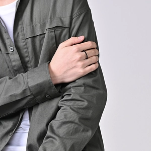 Minimalist black beaded ring for men in a sleek industrial style on hand